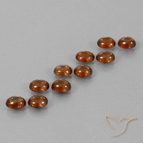 10.23 ctw Orange Zircon Stones, Natural Zircon in Oval Cabochon Shape for Sale