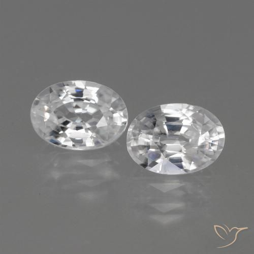2 pezzi Zircone taglio ovale abbinati di dimensioni 7 x 5mm, peso 2,35 ct totali / media. 1,18 ct ciascuno, Bianco in purezza VVS, pietra preziosa naturale , durezza Mohs 6,5 - 7,5 adatto per gioielli da indossare ogni giorno, Simboleggia l'onore e la saggezza, Photo A