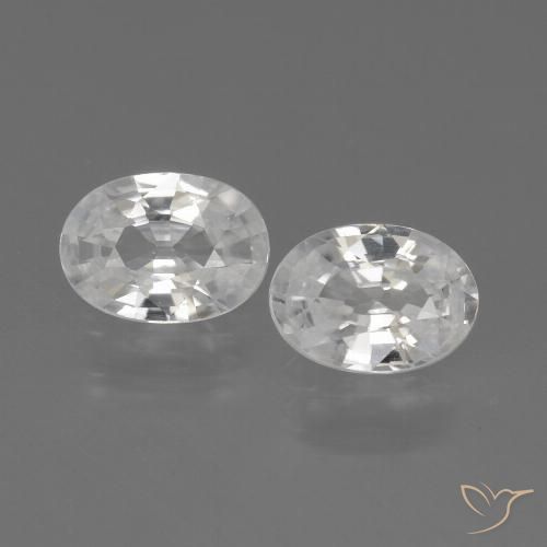 Coppia Zircone Ovale abbinata 7 x 5mm - Peso 2,2 ct totali / media. 1,1 ct ciascuno, pietra preziosa naturale , colore Bianco in purezza VVS-VS, durezza Mohs 6,5 - 7,5 adatto per gioielli da indossare ogni giorno, Mostra grande brillantezza, Photo A